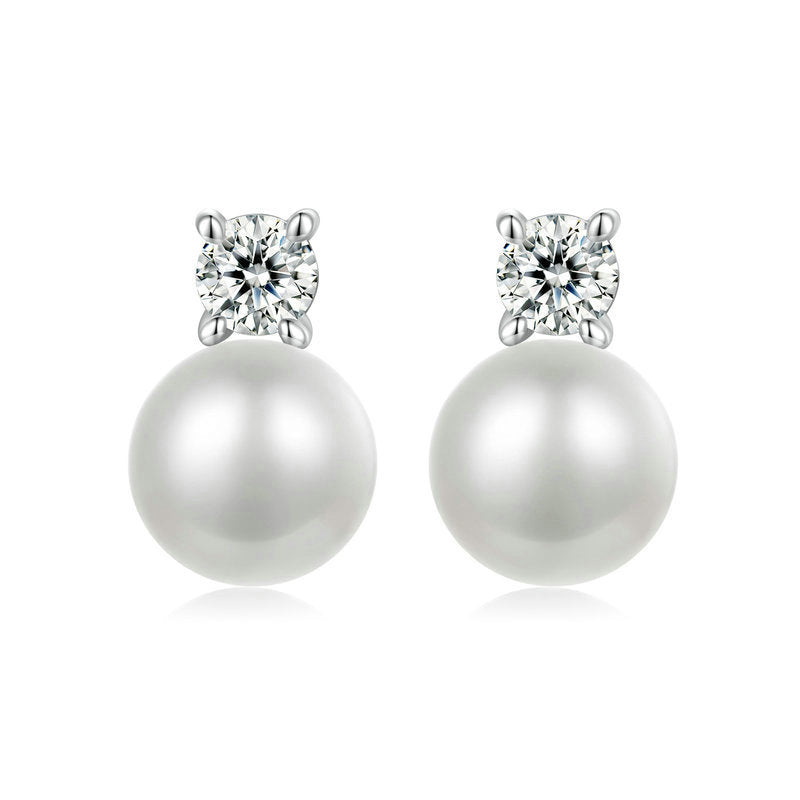 Pearl earrings with 0.1CT moissanite on a white background