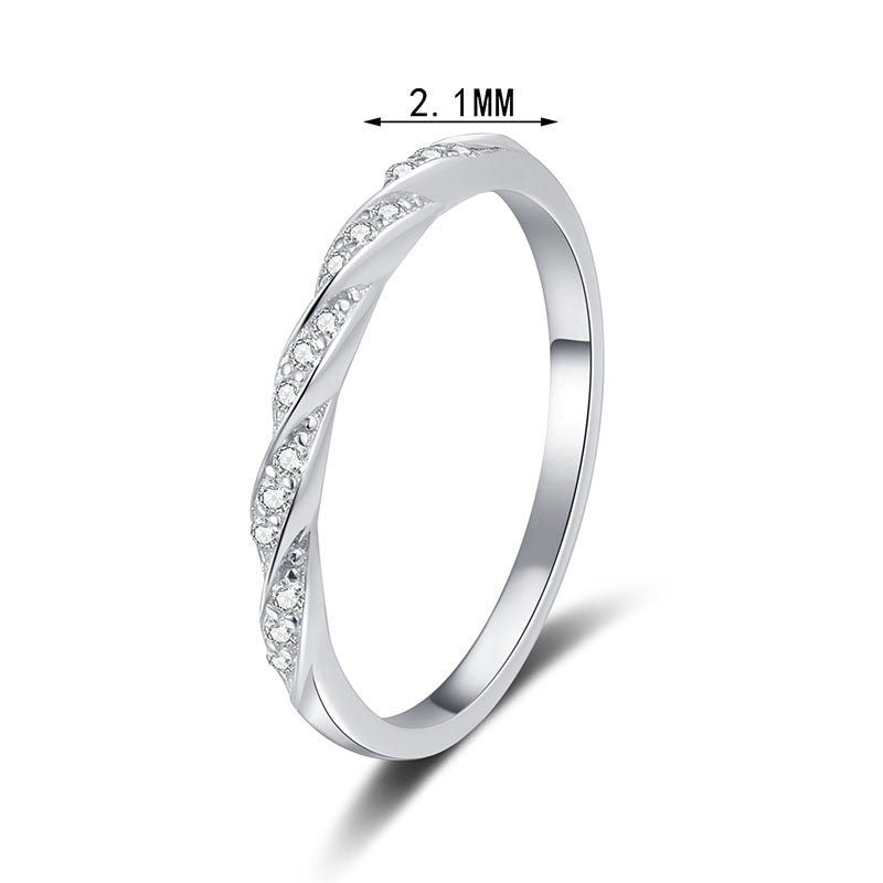 Slim pave twist moissanite band in sterling silver.