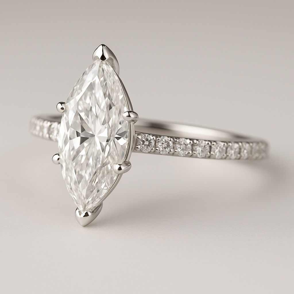 Diamond ring with a marquise-shaped center stone on a light gray background