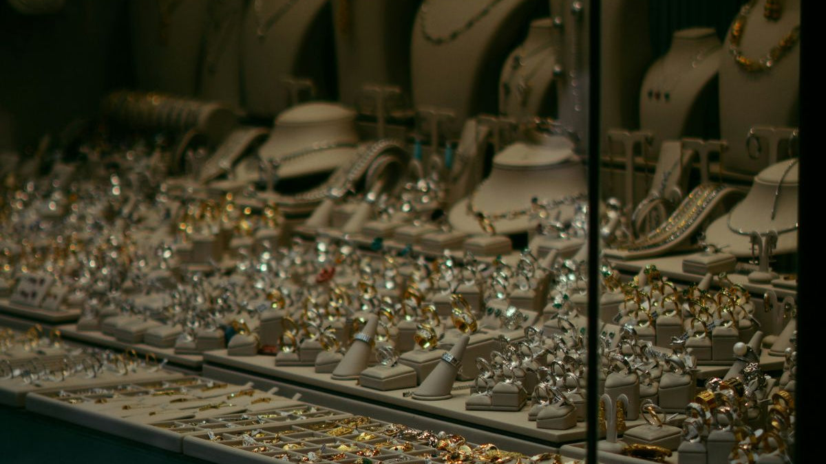 Gold vs platinum jewellery display in store window in Australia .
