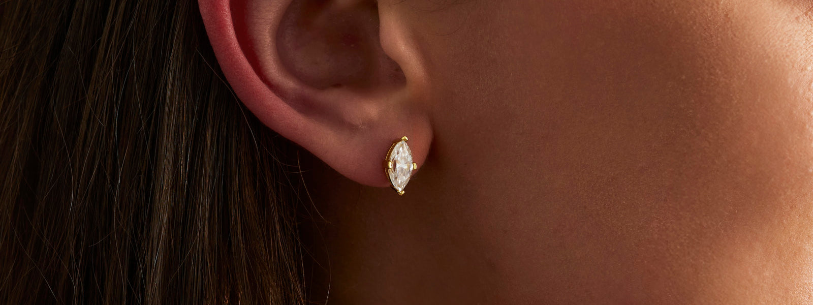 Marquise moissanite stud earring worn on the ear