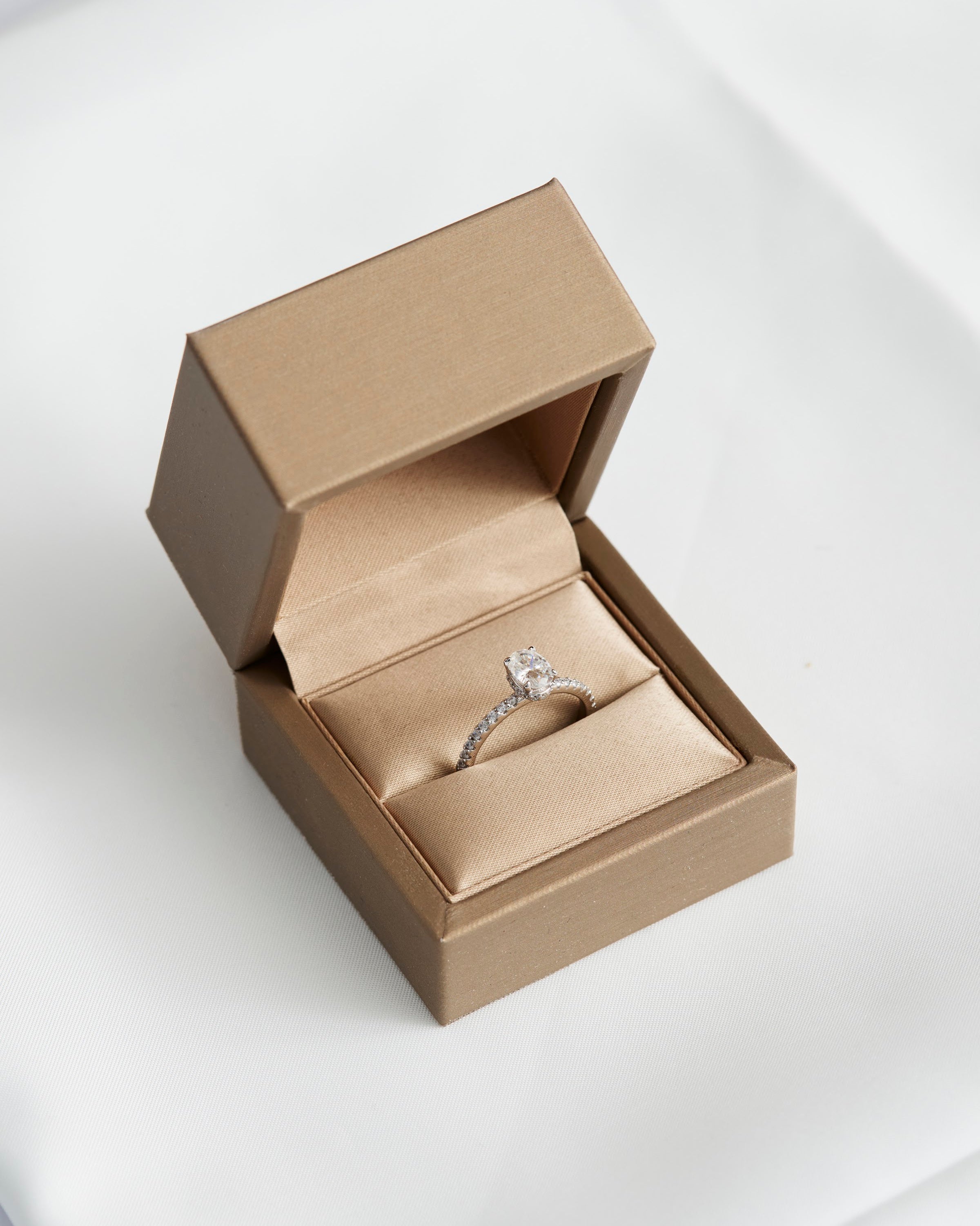 Moissanite solitaire ring in a Prism & Pearl ring box