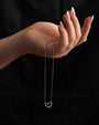 Étoile Pavé Heart Necklace held in hand to show scale