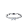 Front view of emerald cut moissanite ring with slim pavé band on a clean white background.
