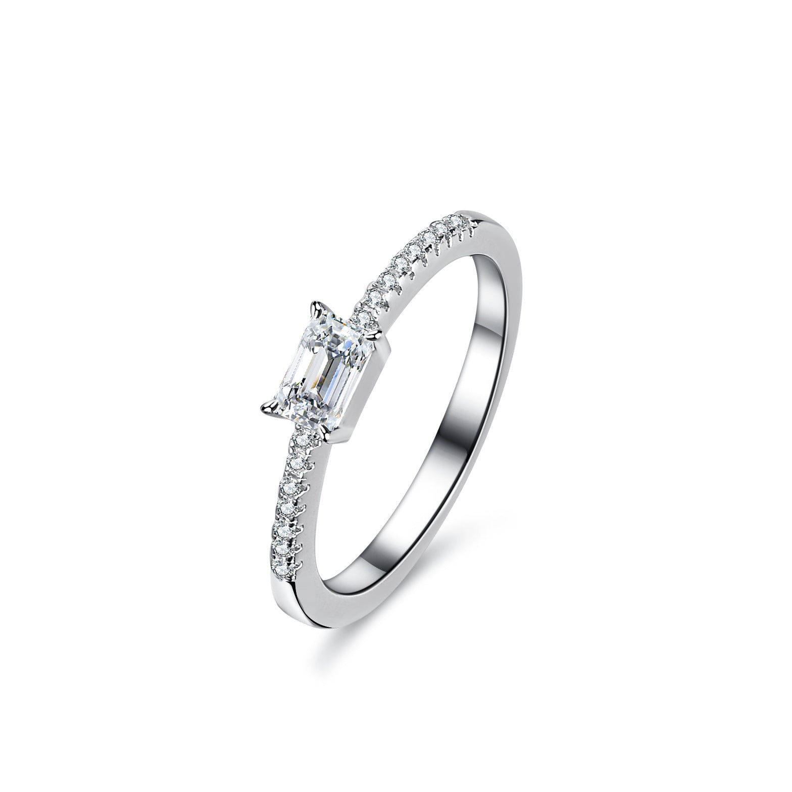 Angled view of emerald cut moissanite ring with pavé stones along the band.
