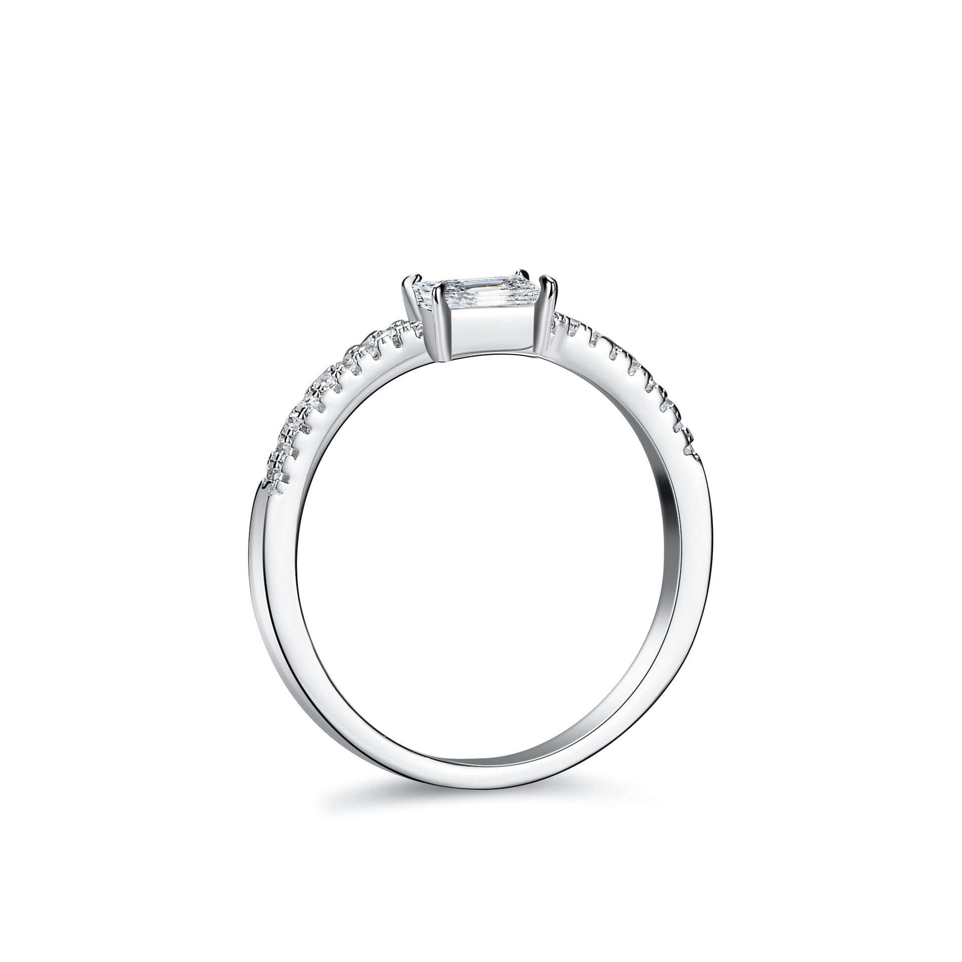 Top view of emerald cut moissanite ring with a slim pavé band in platinum finish.