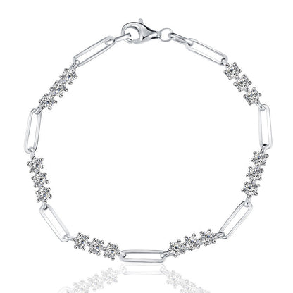 Silver bracelet with paperclip links and diamond accents on a white background