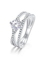 Solitaire moissanite cross band ring with pavé shoulders in sterling silver.