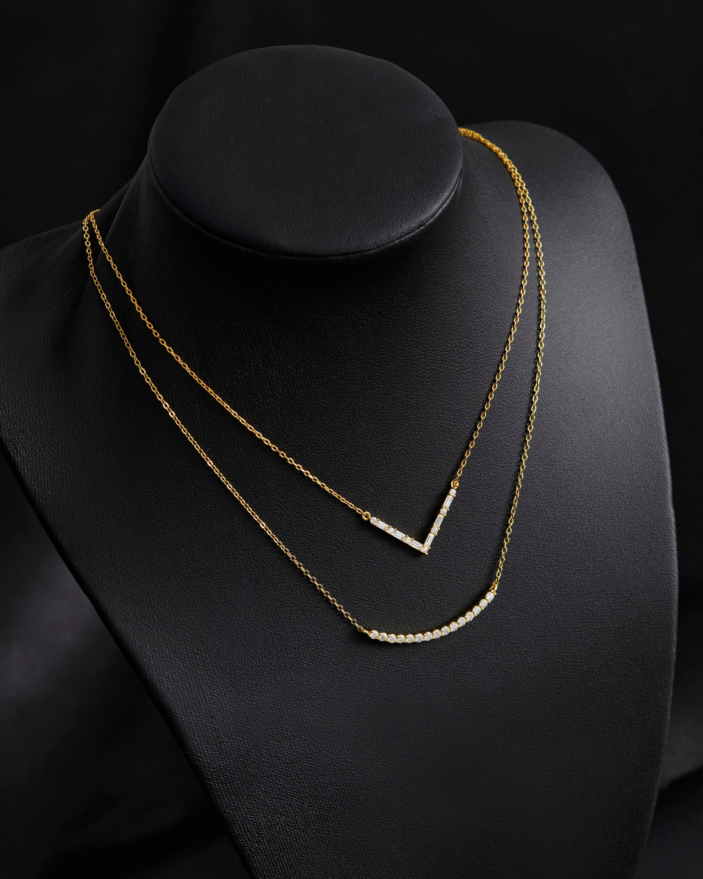 Axelle Pave V Necklace in gold on a display bust