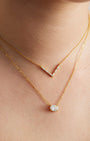 Axelle Pave V Necklace in gold, worn layered