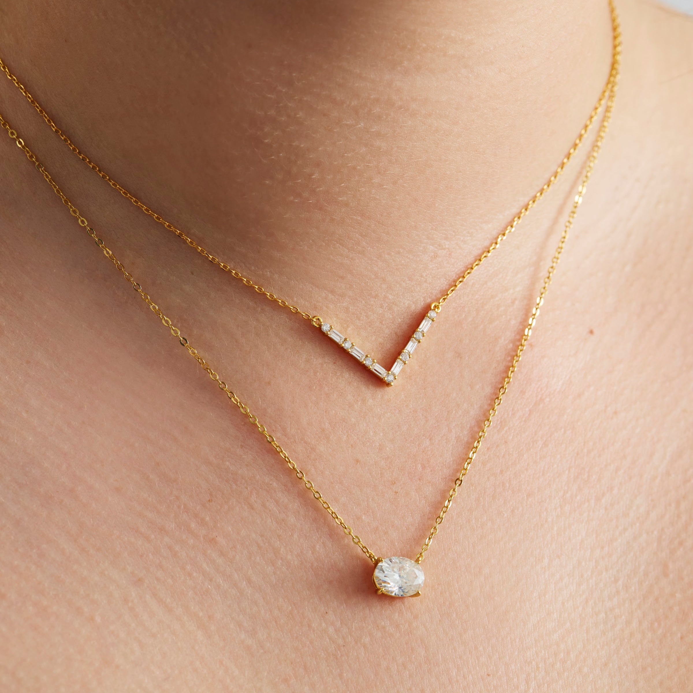Axelle Pave V Necklace in gold, worn layered