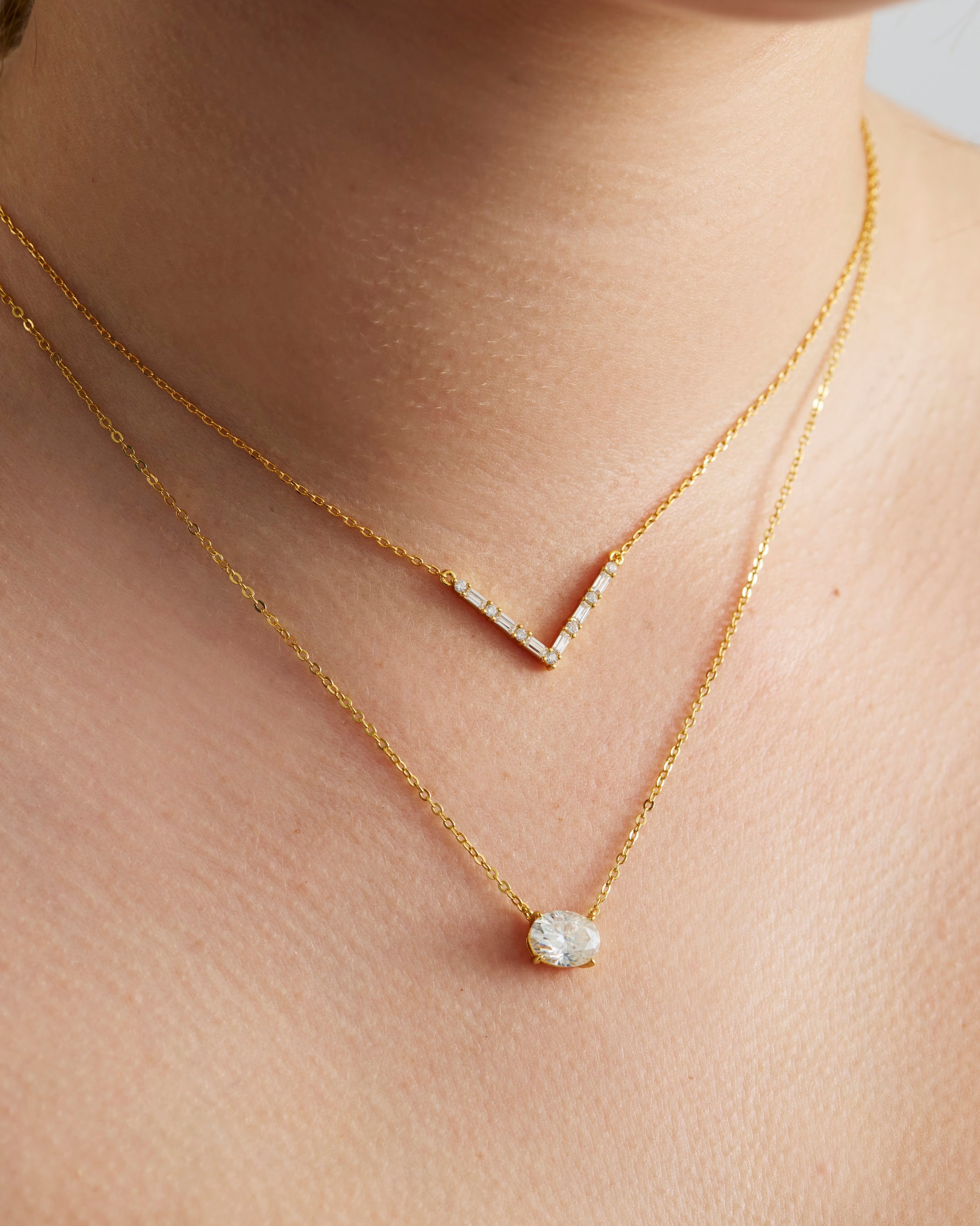 Axelle Pave V Necklace in gold, worn layered