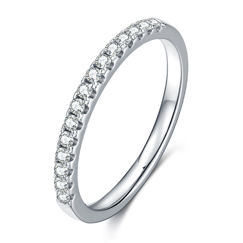 Single row pave moissanite eternity band in sterling silver.