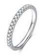Single row pave moissanite eternity band in sterling silver.