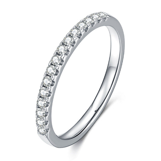 Single row pave moissanite eternity band in sterling silver.