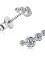 Silver earrings with clear gemstones on a white background