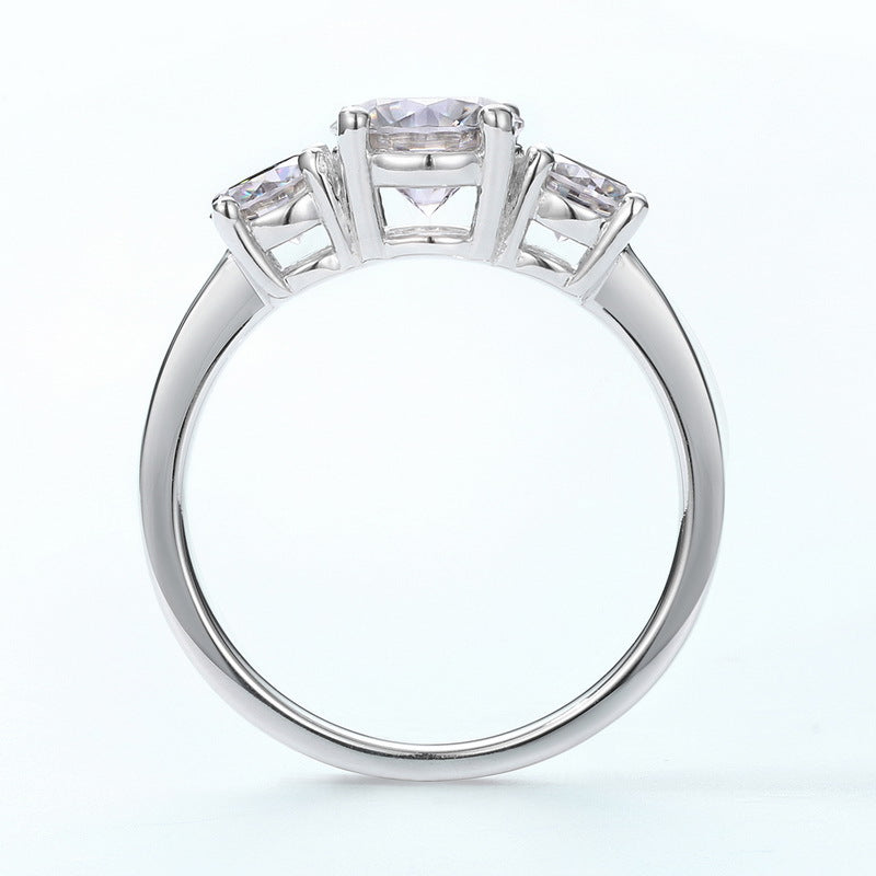Claudia 3 Stone Moissanite Trilogy Ring Side View on a white background by Prism and Pearl