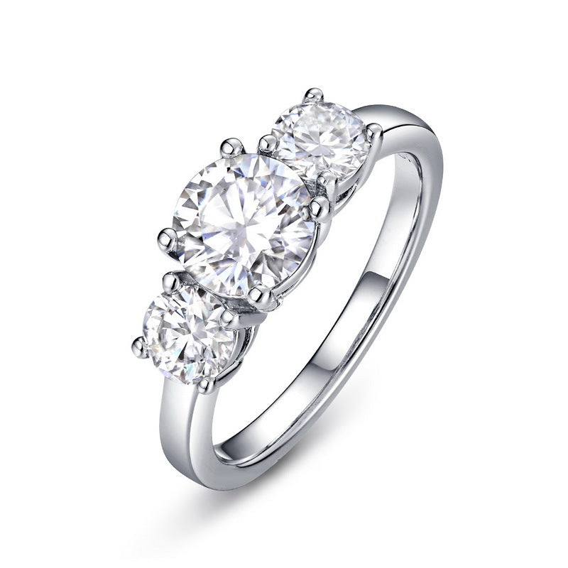 Claudia 3 stone moissanite trilogy ring by Prism and Pearl on white background