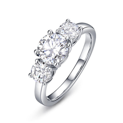 Claudia 3 stone moissanite trilogy ring by Prism and Pearl on white background