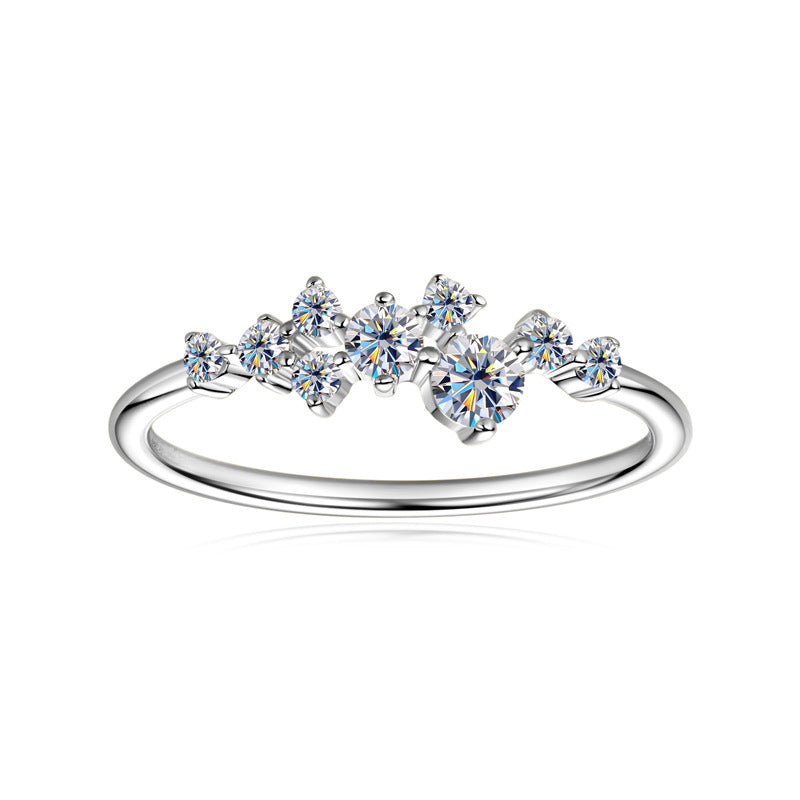 Cluster moissanite ring on a slim sterling silver band.