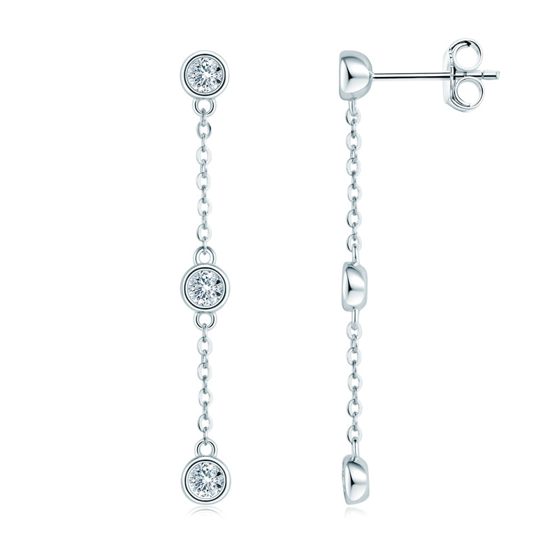 Pair of silver earrings with diamond drops on a white background