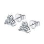 Pair of silver stud earrings with a trio of moissanite gemstones on a white background
