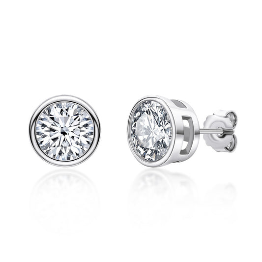 Pair of silver stud earrings with moissanite bezel set gemstones on a white background