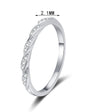 Slim pave twist moissanite band in sterling silver.