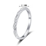 Slim pave twist moissanite band in sterling silver.