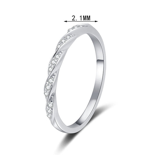 Slim pave twist moissanite band in sterling silver.