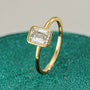 Hannah Emerald Cut Bezel Solitaire Side View on green ring box close up