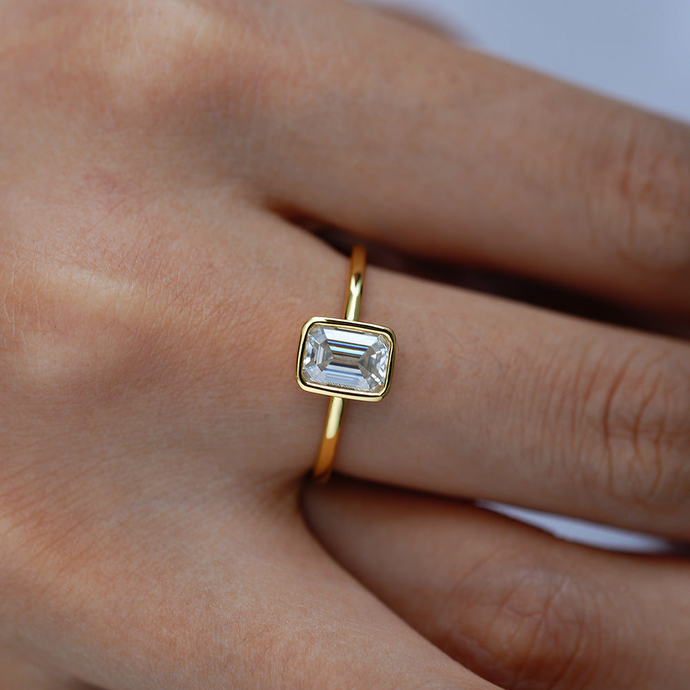 Hannah Emerald Cut Bezel Solitaire On Finger