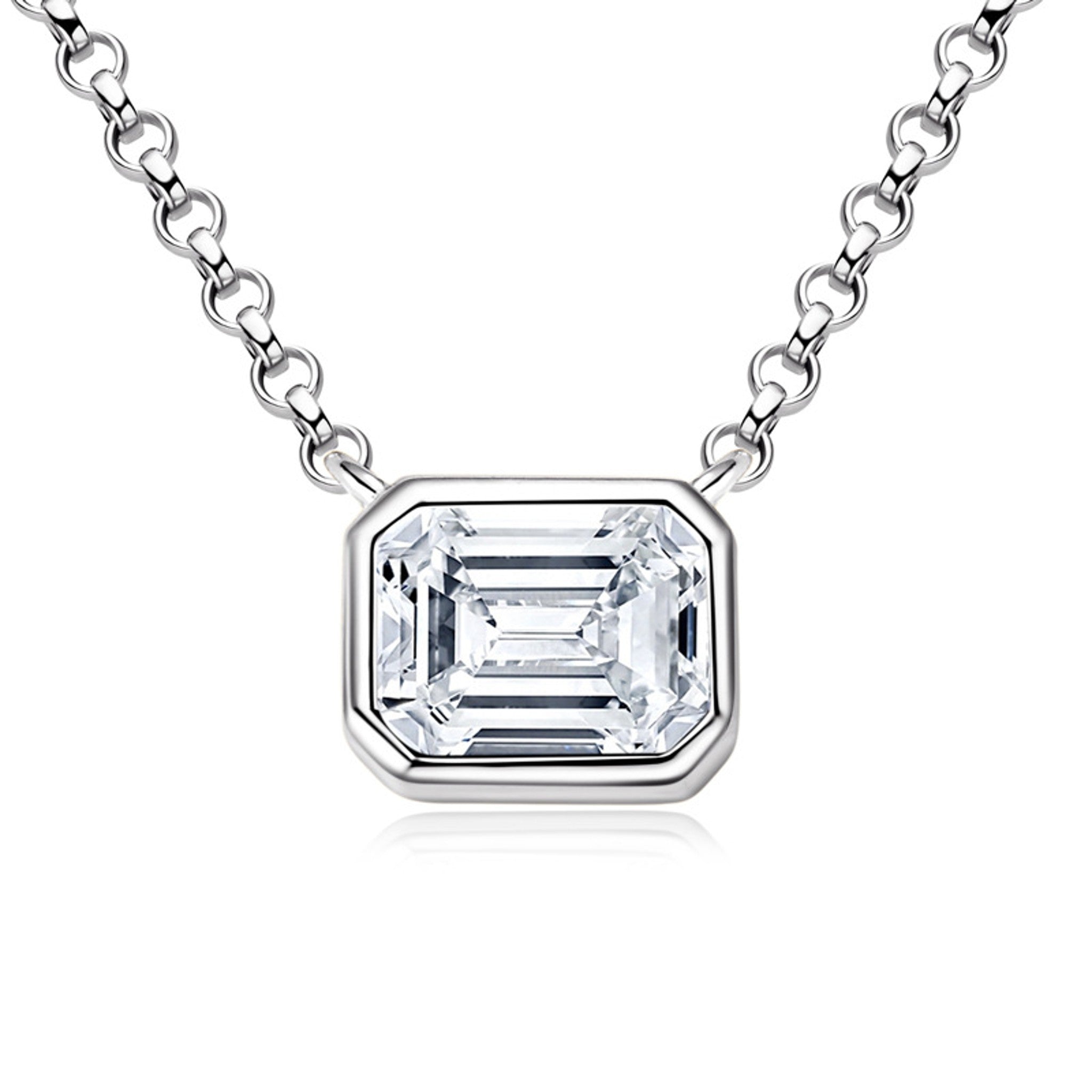Emerald cut moissanite in a sleek bezel pendant