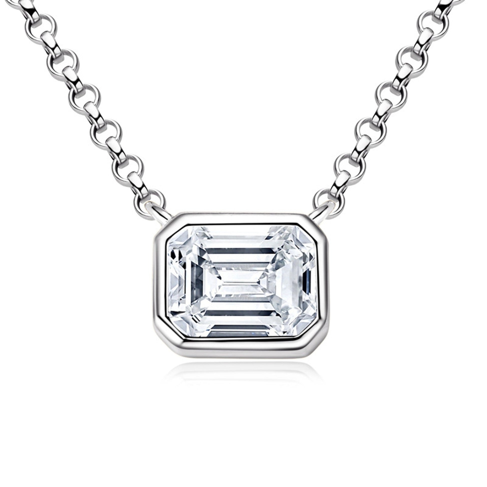 Emerald cut moissanite in a sleek bezel pendant