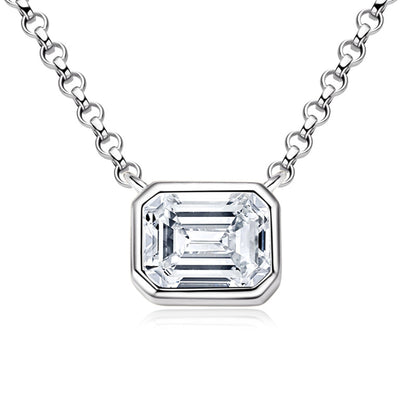 Emerald cut moissanite in a sleek bezel pendant