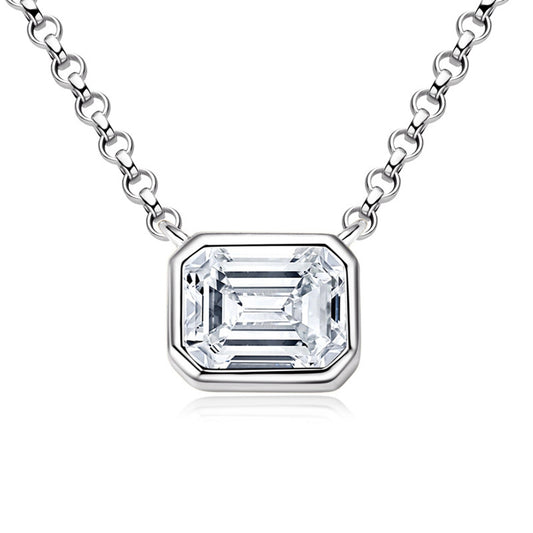 Emerald cut moissanite in a sleek bezel pendant