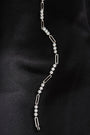 Heloise Gem Link Bracelet laid flat on black fabric