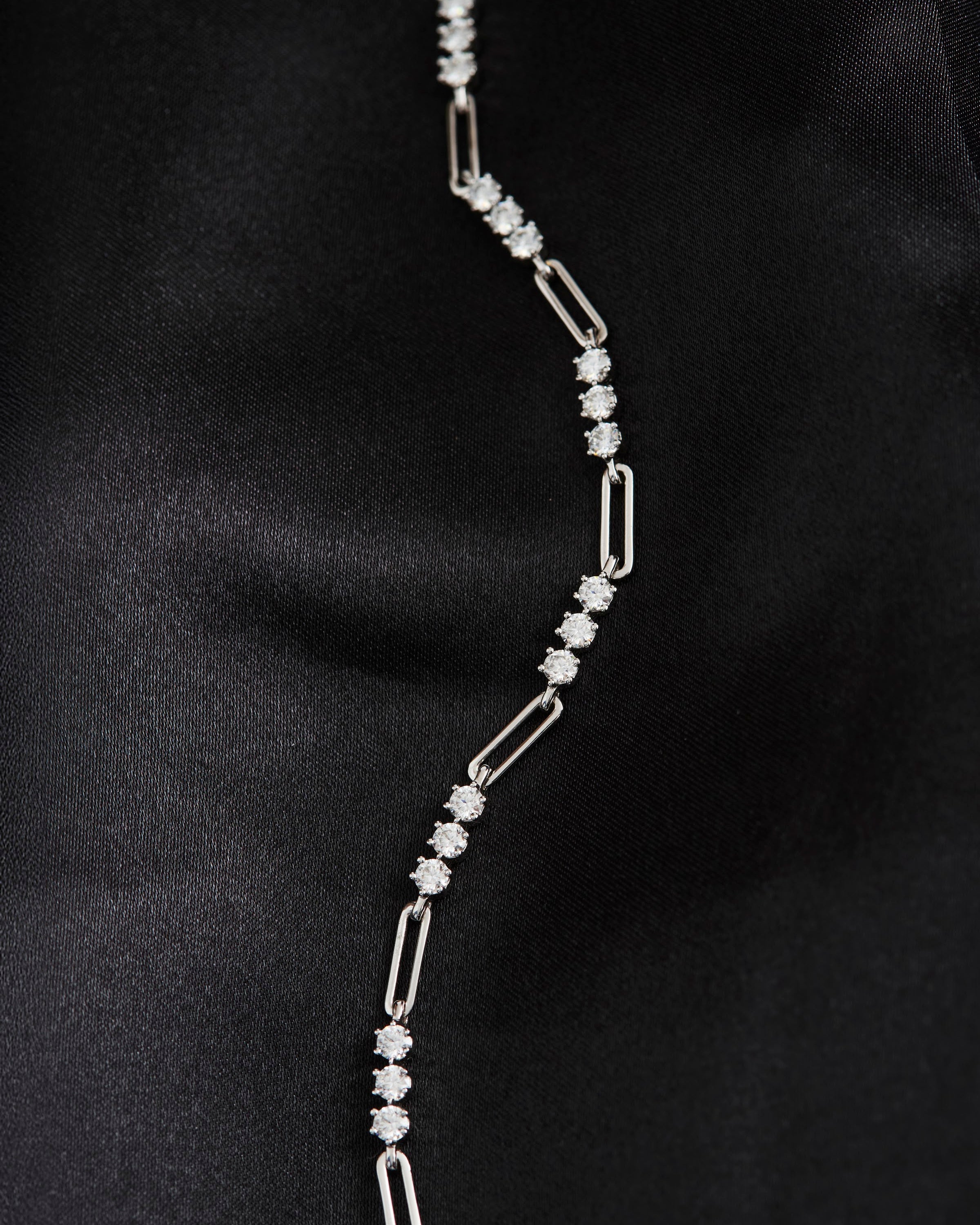 Heloise Gem Link Bracelet laid flat on black fabric