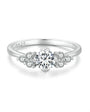 Petite flower cluster moissanite ring in sterling silver.