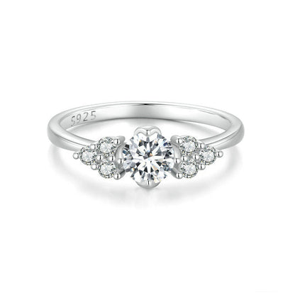 Petite flower cluster moissanite ring in sterling silver.