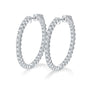 Pair of silver hoop earrings with 1.56ct of moissanite gemstones on a white background