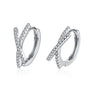 Pair of silver hoop earrings with pavé diamonds on a white background