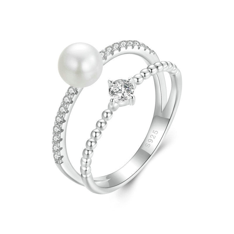 Double band pearl and moissanite pavé ring in sterling silver.