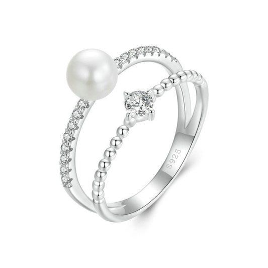 Double band pearl and moissanite pavé ring in sterling silver.