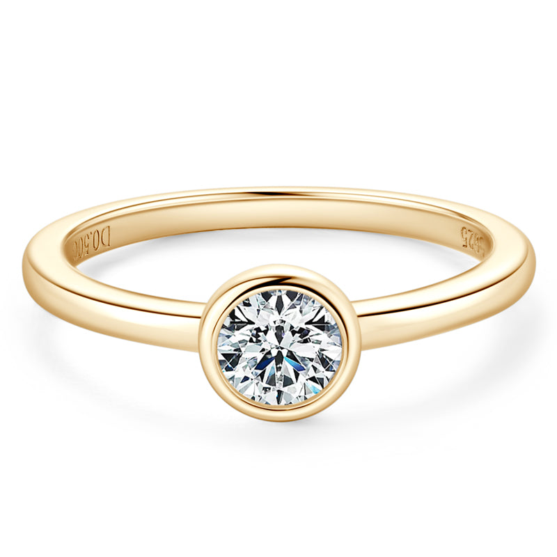 The Maxine Solitaire Bezel Ring in gold on white background