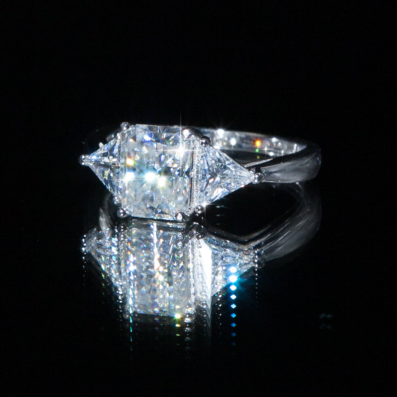 Noemie_Radiant Moissanite on Floor with shiny black reflection Front_Side_Reflection_View_Prism_and_Pearl