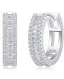 Pair of silver hoop earrings with clear gemstones on a white background