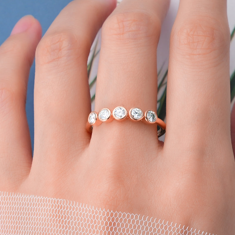 Seraphina 5 Stone Bezel Set moissanite Ring on middle finger prism and pearl 