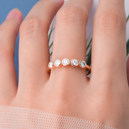 Seraphina 5 Stone Bezel Set moissanite Ring on middle finger prism and pearl 