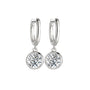Silver hoop earrings with 1ct bezel set moissanites  on white background